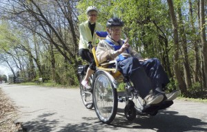 Barb driving her dad, Lee, on the Constitution Trail in Bloomington. Photo by Lenore Sobota of the Pantagraph.