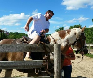 Sam rides a horse