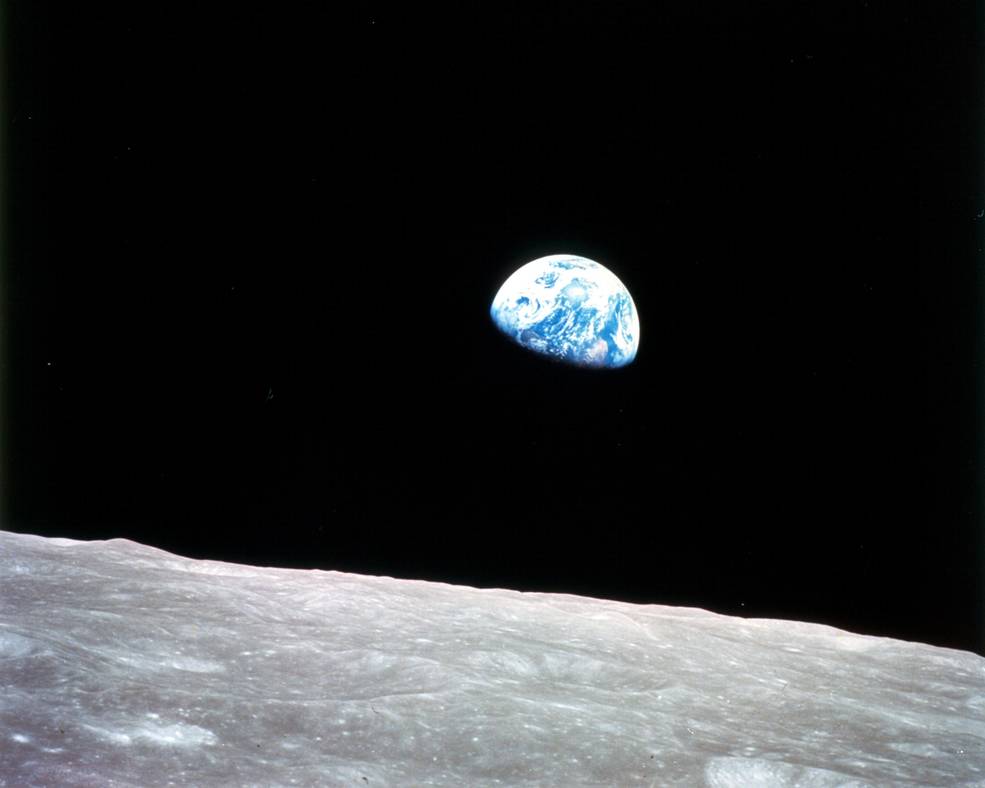 Earth rising above the lunar horizon