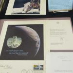 two items placed on the left hand side of the Apollo 11 exhibit case