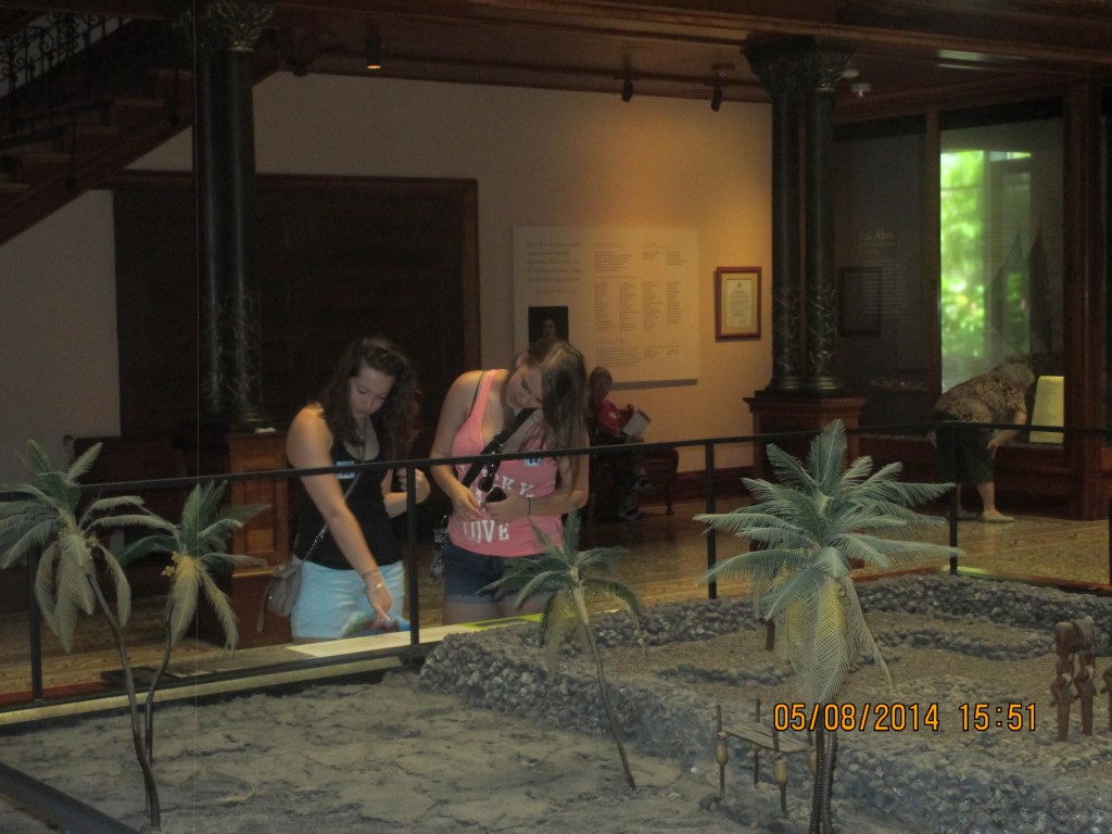 Natalie S. & Sarah V. view a scaled model of an ancient Hawaiian sacred space...